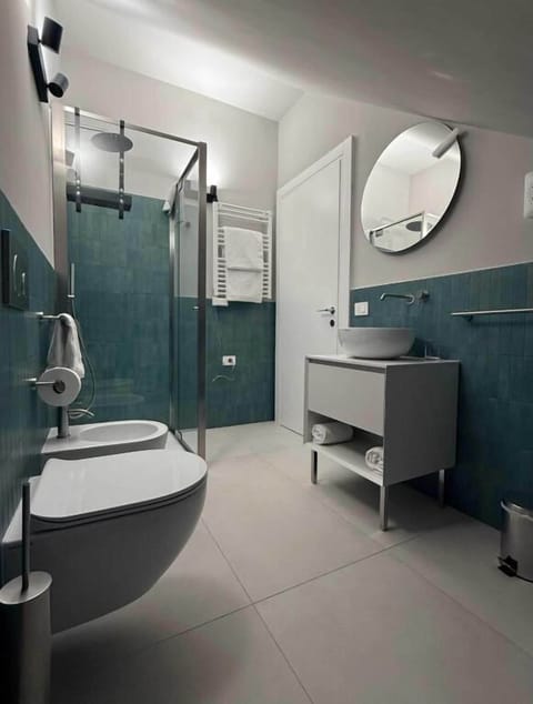 Shower, hair dryer, slippers, towels