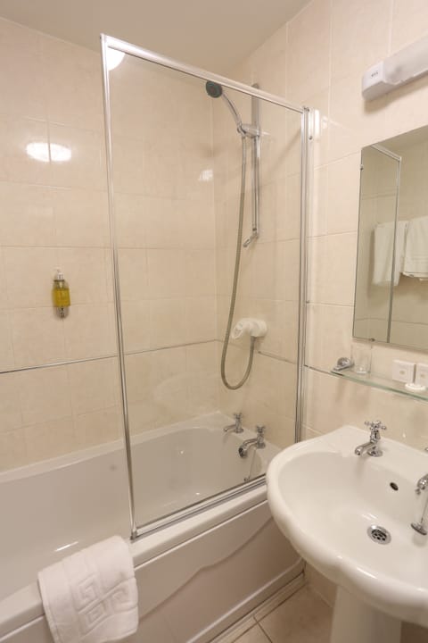 Combined shower/tub, hair dryer, towels, soap