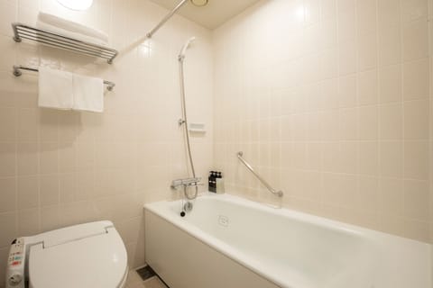 Combined shower/tub, free toiletries, hair dryer, slippers