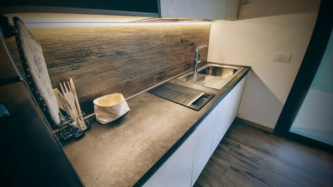 Deluxe Apartment, Patio, Garden View | Private kitchen | Highchair