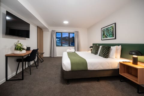 Desk, laptop workspace, blackout drapes, iron/ironing board