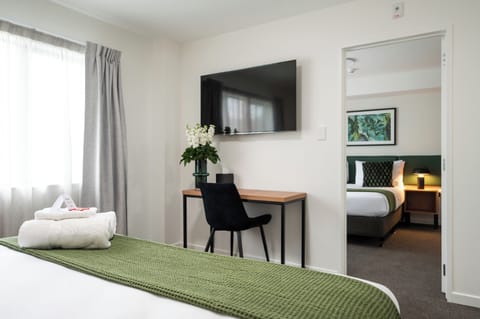 Two Bedroom Apartment | Desk, laptop workspace, blackout drapes, iron/ironing board