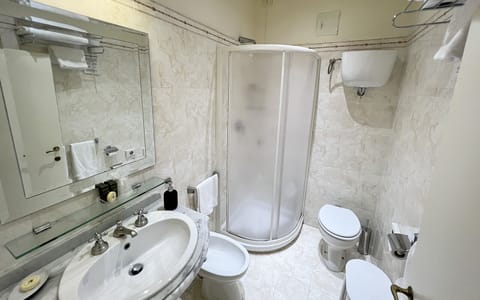 Economy Double or Twin Room | Bathroom | Shower, free toiletries, hair dryer, slippers