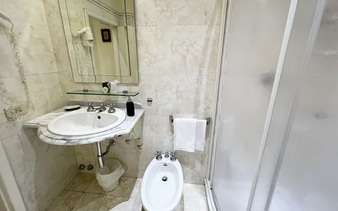 Economy Double or Twin Room | Bathroom | Shower, free toiletries, hair dryer, slippers