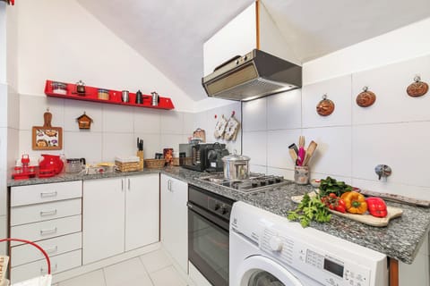 Standard Apartment, 1 Bedroom (Il Balcone Sulle Alpi ski in ski out) | Private kitchen | Fridge, oven, stovetop, coffee/tea maker