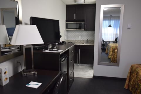 Superior Room, Kitchenette | Desk, blackout drapes, iron/ironing board, free WiFi