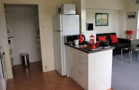 Full-size fridge, microwave, stovetop, coffee/tea maker