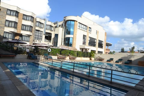 Outdoor pool, open 10:00 AM to 6:00 PM, pool umbrellas, sun loungers