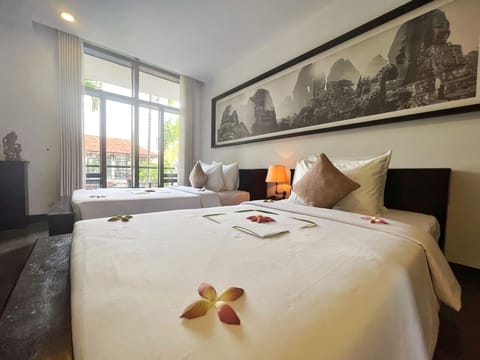 Deluxe Room, Balcony, Pool View | In-room safe, laptop workspace, soundproofing, iron/ironing board