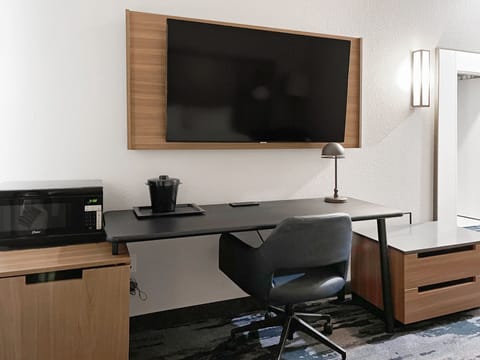 Desk, laptop workspace, blackout drapes, iron/ironing board