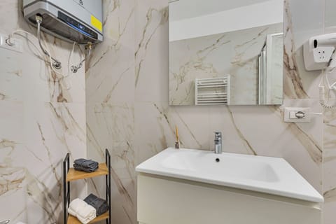 Classic Double Room | Bathroom | Shower, hair dryer, towels, toilet paper