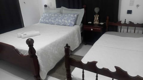 Deluxe Suite, Garden View | Blackout drapes, iron/ironing board, free WiFi