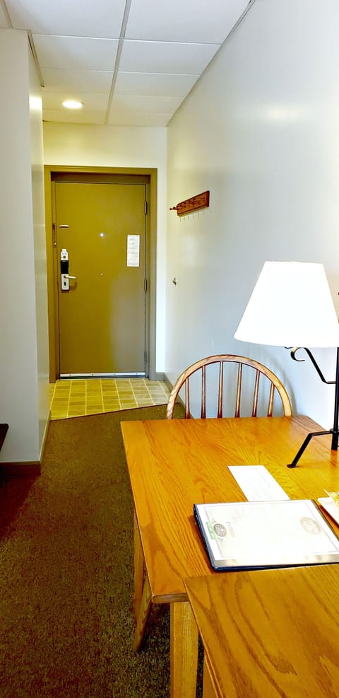 Premium Room, 1 King Bed, Accessible, Ground Floor | Desk, laptop workspace, blackout drapes, iron/ironing board