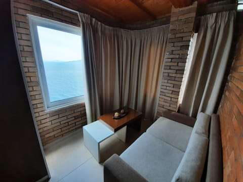 Deluxe Triple Room, Sea View | Desk, free WiFi