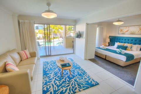 Apartment, 1 Bedroom, Pool Access, Ground Floor | Living area | 32-inch flat-screen TV with cable channels, TV, iPod dock