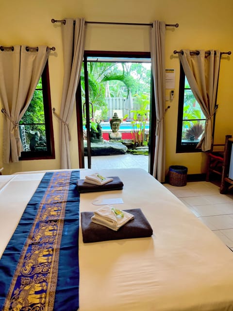 Deluxe Suite, 1 King Bed, Pool View | Minibar, in-room safe, individually furnished, desk