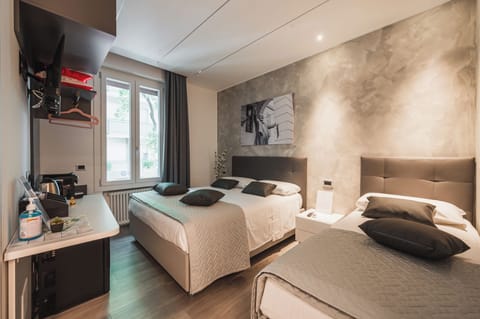 Comfort Triple Room, City View | In-room safe, blackout drapes, soundproofing, free WiFi