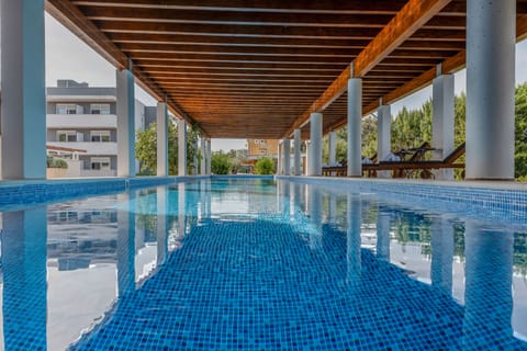 2 outdoor pools, open 8:00 AM to 9:00 PM, pool umbrellas, sun loungers