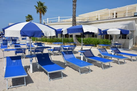 Private beach, white sand, sun loungers, beach umbrellas