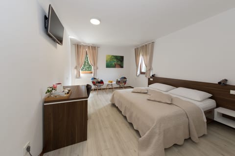 Standard Double Room, Garden View | Memory foam beds, minibar, in-room safe, desk