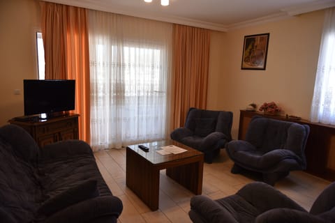 Family Studio, 2 Bedrooms, Sea View | Living area | 22-inch LED TV with satellite channels, TV