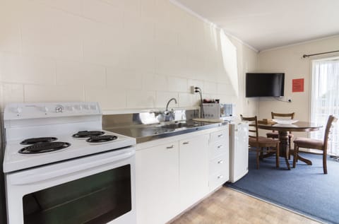 One Bedroom Unit | Private kitchen | Full-size fridge, microwave, oven, stovetop