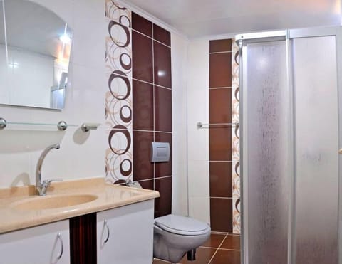 Shower, hair dryer, slippers, towels