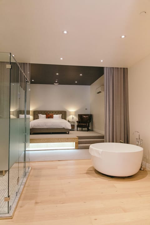 Estate Suite | Bathroom | Designer toiletries, hair dryer, bathrobes, slippers