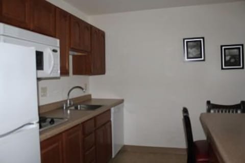 King Suite, 1 Bedroom | Private kitchen | Fridge, coffee/tea maker