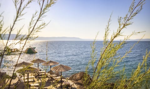 On the beach, sun loungers, beach umbrellas, beach towels