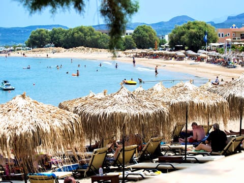 On the beach, sun loungers, beach umbrellas, beach towels