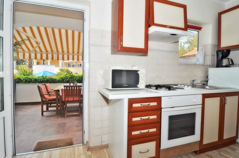 Apartment, 2 Bedrooms, Terrace, Pool View | Private kitchen | Full-size fridge, oven, stovetop, coffee/tea maker