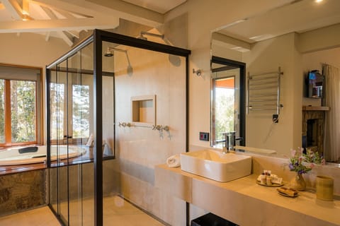 Superior Suite | Bathroom | Designer toiletries, hair dryer, bathrobes, slippers