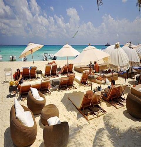 Beach nearby, white sand, beach towels