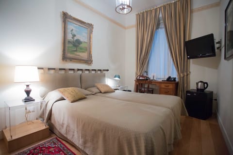 Double or Twin Room | Minibar, desk, laptop workspace, soundproofing