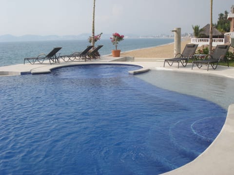 Outdoor pool, an infinity pool, sun loungers