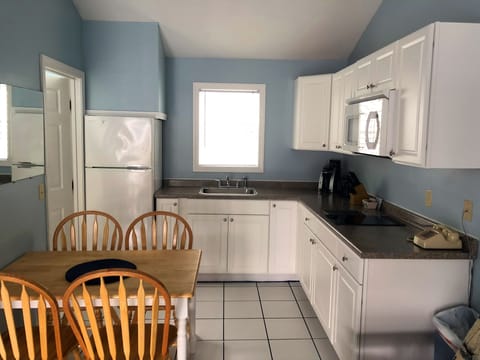 Studio, Multiple Beds | Private kitchen | Full-size fridge, microwave, stovetop, coffee/tea maker