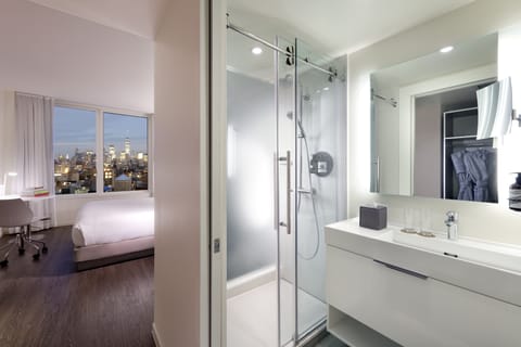 The Family Loft City View | Bathroom | Designer toiletries, hair dryer, slippers, towels