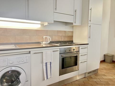 Apartment, 2 Bedrooms (Split Level) | Private kitchen | Full-size fridge, microwave, oven, stovetop