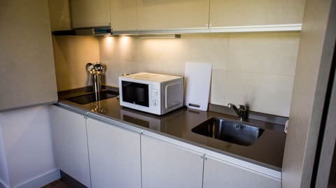 Apartment, 2 Bedrooms | Private kitchen | Fridge, microwave, stovetop, coffee/tea maker