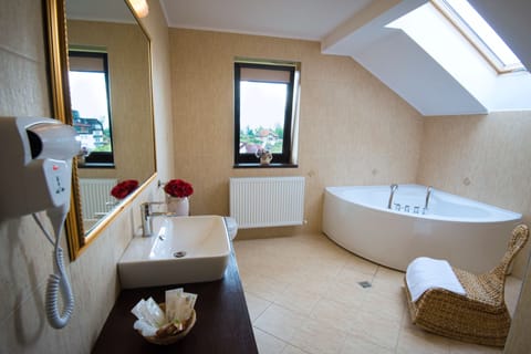 Suite, 1 Bedroom, Balcony | Bathroom | Free toiletries, hair dryer, slippers, towels