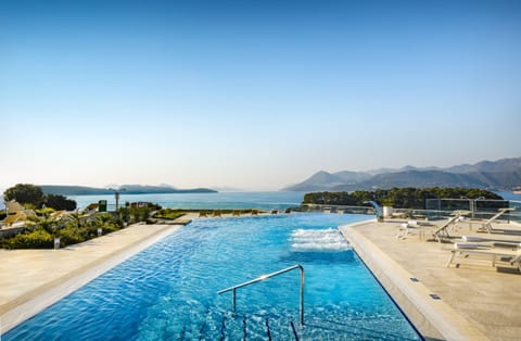 Indoor pool, seasonal outdoor pool, pool umbrellas, sun loungers