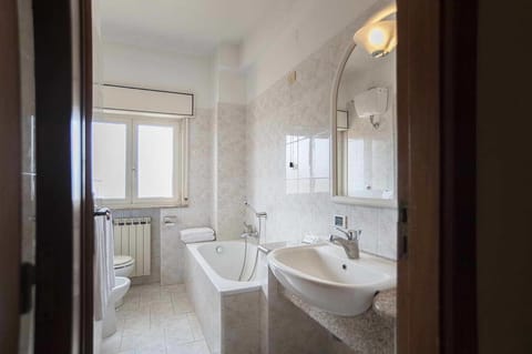 Separate tub and shower, hair dryer, towels