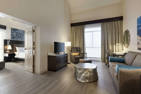 Deluxe Suite, 1 King Bed | Premium bedding, in-room safe, laptop workspace, iron/ironing board