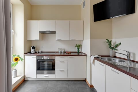 Premium Apartment, Balcony | Private kitchen | Full-size fridge, stovetop, dishwasher, coffee/tea maker