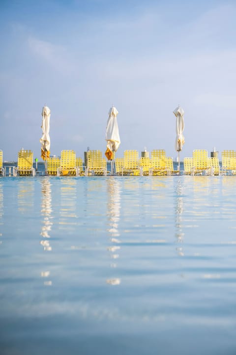 Outdoor pool, pool umbrellas, sun loungers