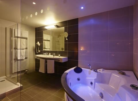 Suite, Jetted Tub | Bathroom | Free toiletries, hair dryer, towels