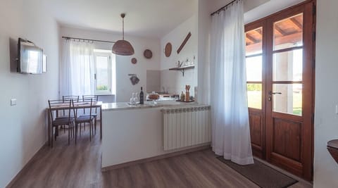 Apartment, 1 Bedroom, Non Smoking, Ground Floor (GIRASOLE) | Private kitchen | Full-size fridge, stovetop, cookware/dishes/utensils, dining tables