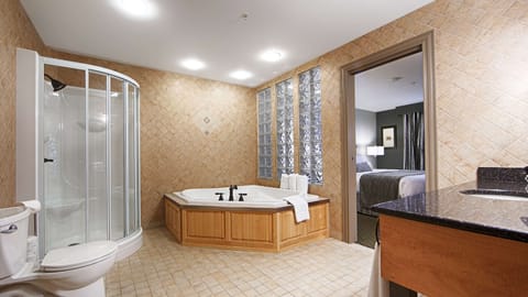 Suite, 1 King Bed, Non Smoking, Jetted Tub (with Sofabed) | Bathroom | Hair dryer, towels