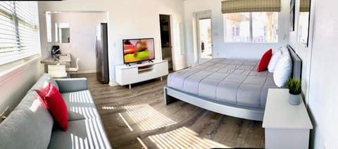 Exclusive Studio Suite, 1 King Bed, Kitchenette, Beach View | Select Comfort beds, individually furnished, iron/ironing board